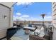 Rooftop patio with lake views, outdoor TV, comfortable seating, and a modern gas heater at 4072 W 17Th Ave, Denver, CO 80204