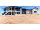 Spacious two-story home with modern design, balcony, and unfinished landscape at 56520 E 74Th Ave, Strasburg, CO 80136