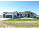 Well designed home showing a large front yard, and oversized garage at 56520 E 74Th Ave, Strasburg, CO 80136