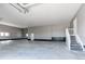 Spacious three car garage featuring ample room for vehicles and storage at 56520 E 74Th Ave, Strasburg, CO 80136