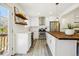 Bright kitchen with white cabinets, stainless steel appliances, and wood countertops at 1549 S Telluride St, Aurora, CO 80017