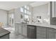 Bright kitchen featuring stainless steel appliances, ample counter space, and seamless flow into the living area at 10103 Meadowbriar Ln, Highlands Ranch, CO 80126