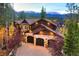 Luxury home aerial view, showcasing mountain views and landscaping at 127 Windwood Cir, Breckenridge, CO 80424
