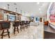 Basement bar with seating and a stone fireplace at 127 Windwood Cir, Breckenridge, CO 80424