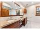 Elegant bathroom with double vanity and a large mirror at 127 Windwood Cir, Breckenridge, CO 80424