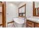 Spa-like bathroom featuring a freestanding soaking tub and window at 127 Windwood Cir, Breckenridge, CO 80424