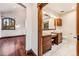 Bathroom with double vanity and a view from the bedroom at 127 Windwood Cir, Breckenridge, CO 80424