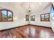 Spacious primary bedroom with hardwood floors and large windows at 127 Windwood Cir, Breckenridge, CO 80424