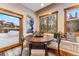 Charming breakfast nook with a wood table and built-in bench seating at 127 Windwood Cir, Breckenridge, CO 80424