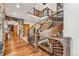 Elegant hallway with hardwood floors and a curved staircase at 127 Windwood Cir, Breckenridge, CO 80424