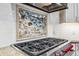 Upscale kitchen features a mosaic backsplash and a professional-grade gas range at 127 Windwood Cir, Breckenridge, CO 80424