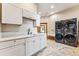 Laundry room with white cabinets and modern appliances at 127 Windwood Cir, Breckenridge, CO 80424