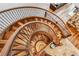 Impressive spiral staircase with wood and metal accents at 127 Windwood Cir, Breckenridge, CO 80424