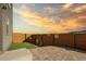 Backyard featuring an outdoor patio and privacy fence against a scenic sky at 15606 W Girard Ave, Morrison, CO 80465