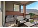 Relaxing balcony featuring a covered BBQ area, comfortable seating and scenic views at 15606 W Girard Ave, Morrison, CO 80465