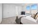 Well-lit bedroom featuring plush carpeting, ample natural light, and a neutral color palette at 15606 W Girard Ave, Morrison, CO 80465