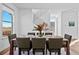 Dining area with modern decor, staircase, and picturesque views from the large window at 15606 W Girard Ave, Morrison, CO 80465