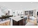The kitchen features a large island with barstool seating, stainless steel appliances, and an open floorplan at 15606 W Girard Ave, Morrison, CO 80465