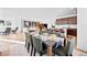 Bright open-concept living space with views of the dining room, kitchen, and a comfortable seating area at 15606 W Girard Ave, Morrison, CO 80465