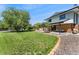 Green backyard featuring a patio area, landscaping and great space for activities and entertaining at 13390 W Warren Ave, Lakewood, CO 80228