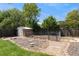 Backyard featuring well manicured lawn, gravel area, shed, and dog run at 13390 W Warren Ave, Lakewood, CO 80228