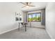 Well-lit bedroom with neutral walls, large window, and sleek desk for focused work at 13390 W Warren Ave, Lakewood, CO 80228