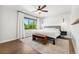 Bright bedroom with large windows, ceiling fan, and comfortable bed at 13390 W Warren Ave, Lakewood, CO 80228