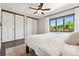 Cozy bedroom with a large window and closet space at 13390 W Warren Ave, Lakewood, CO 80228