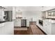 Kitchen features stainless appliances, tile floors, and access to an informal dining space with a view at 13390 W Warren Ave, Lakewood, CO 80228