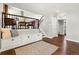 Upstairs living area offers hardwood floors, built-in bench, and stairs to the kitchen at 13390 W Warren Ave, Lakewood, CO 80228