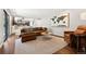 Bright living room boasts open layout, stylish furniture, and lots of natural light at 13390 W Warren Ave, Lakewood, CO 80228