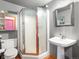 Bathroom featuring a toilet, sink, and glass shower stall at 1792 Wynkoop St # 508, Denver, CO 80202
