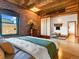 Bedroom featuring exposed brick wall, and an attached area with floor cushions and tatami mats at 1792 Wynkoop St # 508, Denver, CO 80202