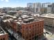 Exterior view of the building featuring an brick facade, black metal balconies, and architectural charm at 1792 Wynkoop St # 508, Denver, CO 80202
