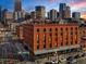 A beautiful brick building stands amidst the city, with a lively street scene unfolding below at 1792 Wynkoop St # 508, Denver, CO 80202