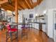 Spacious kitchen with stainless steel appliances, hardwood floors, and a large island with seating at 1792 Wynkoop St # 508, Denver, CO 80202