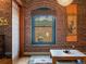 Close up of the living room showcasing exposed brick, a Japanese blind shade, and unique design elements at 1792 Wynkoop St # 508, Denver, CO 80202