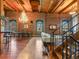 Spacious living room boasting exposed brick walls, high ceilings, a grand chandelier, and abundant natural light at 1792 Wynkoop St # 508, Denver, CO 80202