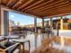 Open-concept living room with hardwood floors and floor-to-ceiling windows leading to a deck at 1792 Wynkoop St # 508, Denver, CO 80202
