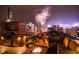 Relaxing rooftop deck with cozy seating, fire pit, outdoor kitchen, and a fantastic fireworks display at 1792 Wynkoop St # 508, Denver, CO 80202