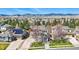 Aerial view of the property showcasing its location, surrounding neighborhood, and mountain views at 6273 Torrey Ln, Arvada, CO 80403
