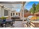 Backyard patio with pergola, hot tub and outdoor kitchen, perfect for entertaining at 6273 Torrey Ln, Arvada, CO 80403