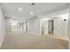 Large carpeted basement with stairway, neutral paint, and storage at 6273 Torrey Ln, Arvada, CO 80403