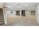 Spacious finished basement with carpet, cabinets, and recessed lighting at 6273 Torrey Ln, Arvada, CO 80403