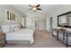 Spacious bedroom with neutral tones, plush carpet, and a large window at 6273 Torrey Ln, Arvada, CO 80403