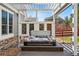 Hot tub in backyard on wood deck beneath pergola at 6273 Torrey Ln, Arvada, CO 80403