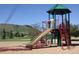 Have fun at the community playground with slides, climbing ropes, and mountain views at 6273 Torrey Ln, Arvada, CO 80403