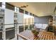 Relaxing balcony with outdoor seating, a wooden table, and city views at 790 N Washington St # 1003, Denver, CO 80203