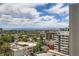 Scenic city view featuring high-rise buildings, lush greenery, and distant mountain range at 790 N Washington St # 1003, Denver, CO 80203