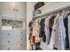 Organized walk-in closet with shelving, clothing racks, and ample storage space at 790 N Washington St # 1003, Denver, CO 80203